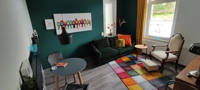 Ein Sitzbereich in der Unterkunft Villa Kunterbunt, Gemütlichkeit am Waldesrand