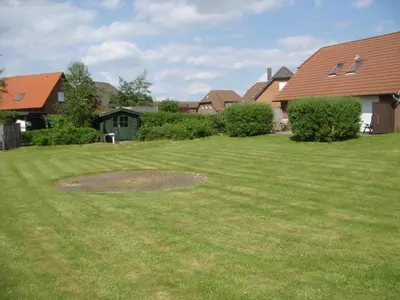 Ein Garten an der Unterkunft Haus Sandboll DHH2