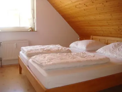 Ein Bett oder Betten in einem Zimmer der Unterkunft Haus Sandboll DHH1
