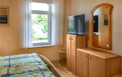 TV/Unterhaltungsangebot in der Unterkunft Cozy Apartment In Wurster Nordseeküste