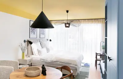 Ein Bett oder Betten in einem Zimmer der Unterkunft Seehuus Duhnen Apartments
