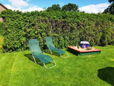 Ein Garten an der Unterkunft Haus Küstenheide