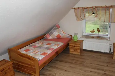 Ein Bett oder Betten in einem Zimmer der Unterkunft Haus Küstenheide