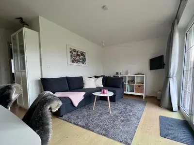 Ein Sitzbereich in der Unterkunft Ferienwohnung Nordseenest