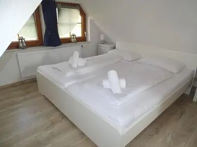 Ein Bett oder Betten in einem Zimmer der Unterkunft Haus Frieda