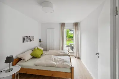 Ein Bett oder Betten in einem Zimmer der Unterkunft Maike