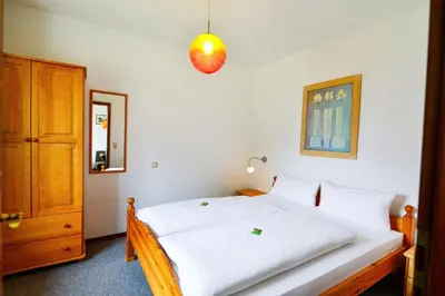 Ein Bett oder Betten in einem Zimmer der Unterkunft Land und Meer LM15