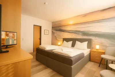 Ein Bett oder Betten in einem Zimmer der Unterkunft City Center Hotel Garni Cuxhaven