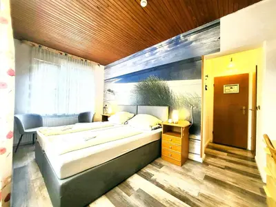 Ein Bett oder Betten in einem Zimmer der Unterkunft City Center Hotel Garni Cuxhaven