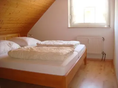 Ein Bett oder Betten in einem Zimmer der Unterkunft Haus Tötel DHH 4