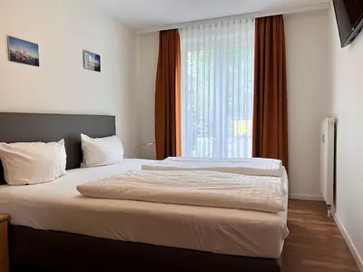 Ein Bett oder Betten in einem Zimmer der Unterkunft Haus am Mühlenpark Whg. 2