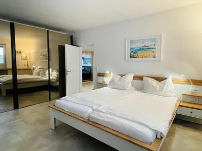 Ein Bett oder Betten in einem Zimmer der Unterkunft Haus Seehund FeWo 15