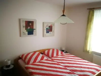 Ein Bett oder Betten in einem Zimmer der Unterkunft FeWo Grüne Wiese