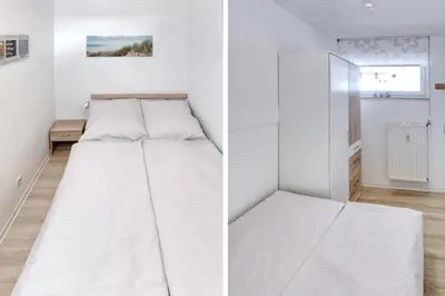 Ein Bett oder Betten in einem Zimmer der Unterkunft Terrassenhaus, FeWo 73