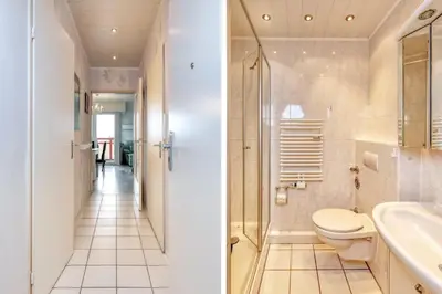 Ein Badezimmer in der Unterkunft Terrassenhaus, FeWo 66