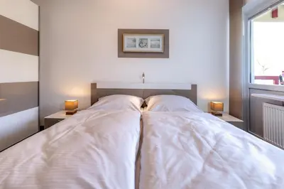 Ein Bett oder Betten in einem Zimmer der Unterkunft Terrassenhaus, FeWo 20