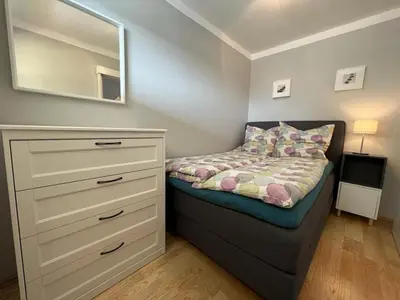 Ein Bett oder Betten in einem Zimmer der Unterkunft Terrassenhaus, FeWo 41