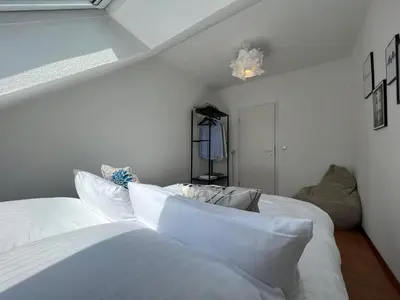 Ein Bett oder Betten in einem Zimmer der Unterkunft Luxuriöse Penthaus Wohnung in Cuxhaven # Cosiness Company