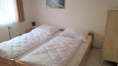 Ein Bett oder Betten in einem Zimmer der Unterkunft Leichtmatrose