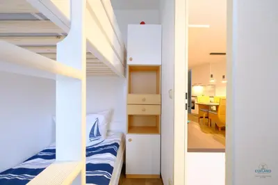 Ein Bett oder Betten in einem Zimmer der Unterkunft Haus Lord Nelson Döse Wohnung 406