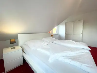 Ein Bett oder Betten in einem Zimmer der Unterkunft Haus Eversand Nr 1