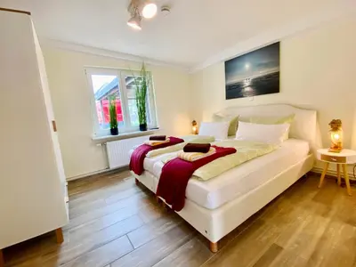 Ein Bett oder Betten in einem Zimmer der Unterkunft Am Oland 11 Bungalow