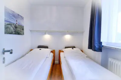 Ein Bett oder Betten in einem Zimmer der Unterkunft Am Sahlenburger Strand AS07