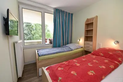 Ein Bett oder Betten in einem Zimmer der Unterkunft Haus Trafalger Appartement TR147