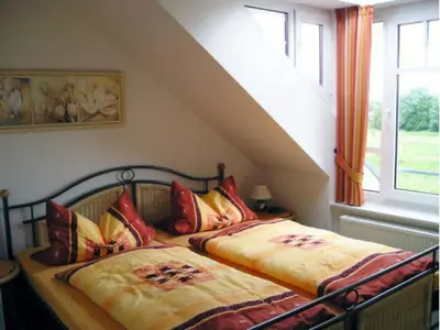 Ein Bett oder Betten in einem Zimmer der Unterkunft de Tampen
