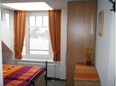 Ein Bett oder Betten in einem Zimmer der Unterkunft de Tampen
