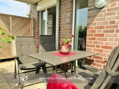 Ein Sitzbereich in der Unterkunft De Reetpieper