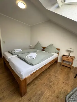 Ein Bett oder Betten in einem Zimmer der Unterkunft Ferienwohnung Molly