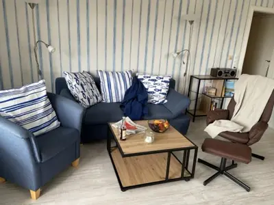 Ein Sitzbereich in der Unterkunft Wattnest - Ferienwohnung direkt in erster Meereslinie am Deich