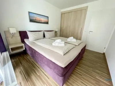 Ein Bett oder Betten in einem Zimmer der Unterkunft Residenz Hohe Lith Duhnen Wohnung 1 Haus 3
