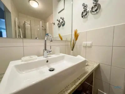 Ein Badezimmer in der Unterkunft Residenz Hohe Lith Duhnen Wohnung 1 Haus 3