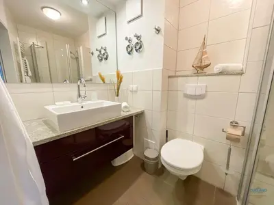 Ein Badezimmer in der Unterkunft Residenz Hohe Lith Duhnen Wohnung 1 Haus 3