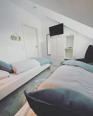 Ein Bett oder Betten in einem Zimmer der Unterkunft Ferienwohnung Watt un Leev in direkter Strand & Citynähe von Büsum