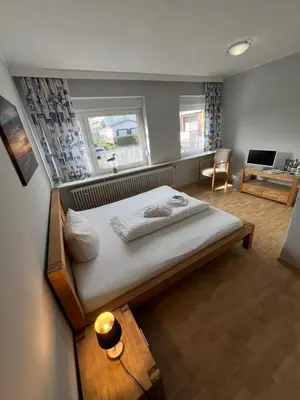Ein Bett oder Betten in einem Zimmer der Unterkunft Hotel Tum Stüürmann