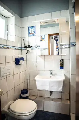 Ein Badezimmer in der Unterkunft Hotel Tum Stüürmann