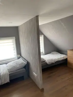Ein Bett oder Betten in einem Zimmer der Unterkunft Koog Rooms