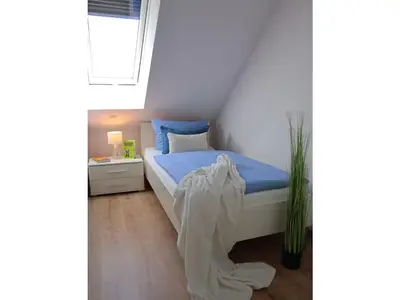 Ein Bett oder Betten in einem Zimmer der Unterkunft Ferienhaus Lee