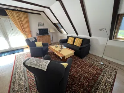 Ein Sitzbereich in der Unterkunft Haus am Deich