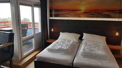Ein Bett oder Betten in einem Zimmer der Unterkunft LITTLE SKYSUITE W94 inkl Ebikes Pool Sauna