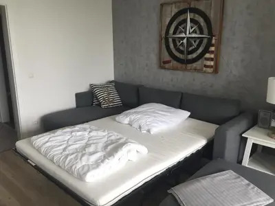 Ein Bett oder Betten in einem Zimmer der Unterkunft FeWo Nordseestraße