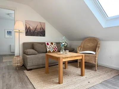 Ein Sitzbereich in der Unterkunft Kapitänshaus FeWo 3