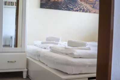 Ein Bett oder Betten in einem Zimmer der Unterkunft Frische Brise FeWo 15 09