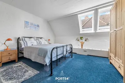 Ein Bett oder Betten in einem Zimmer der Unterkunft Ferienwohnung Hausboot an der Lagune Kombüse Büsum