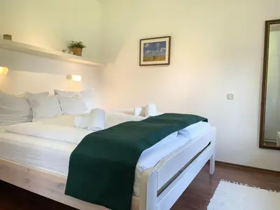 Ein Bett oder Betten in einem Zimmer der Unterkunft Haus Land & Meer FeWo14