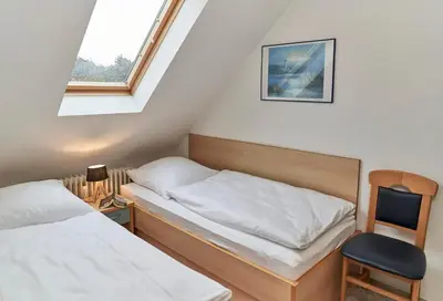 Ein Bett oder Betten in einem Zimmer der Unterkunft Dallacker 7 - Dachgeschoss