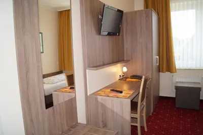 Ein Bett oder Betten in einem Zimmer der Unterkunft Hotel Neuses